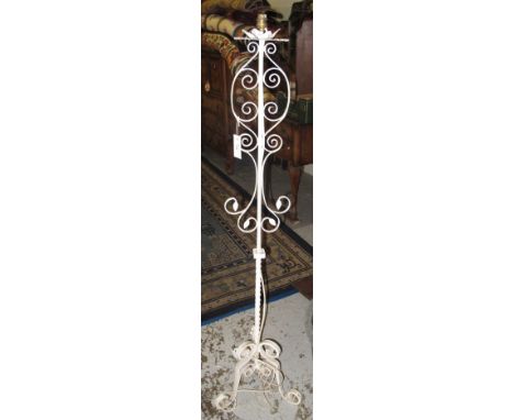 Wrought iron, scroll decorated standard lamp on triform base.