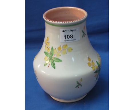 A Poole pottery baluster shaped vase, transfer printed and painted with sprays of flowers and leaves.  Impressed marks with n