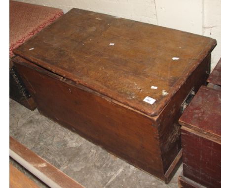 Vintage pine trunk with metal carrying handles.