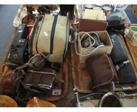 Two trays of assorted items to include vintage cased cameras, Olympus camera in canvas bag, medical items in fitted cases by 