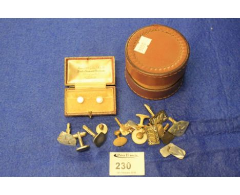 Leather box containing assorted white yellow metal cufflinks and boxed mother of pearl studs.  (2) 