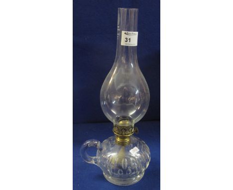 Thumb cut glass chamber oil lamp with brass burner and clear shade. 