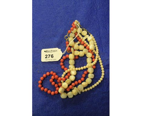 Coral beads and two strings of mother of pearl beads.