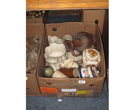 Box of assorted china to include stoneware bottles, various mugs, lidded fruit canister, ceramic floral planters etc.