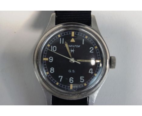 Hamilton G S military stainless steel wrist watch, circular signed black dial with white Arabic numerals luminous dots, plus 