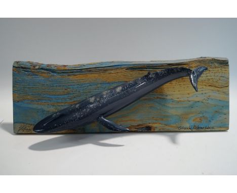 A ceramic model of a Baleen Blue Whale by French ceramicist Jacques Kistinig, limited edition of 80, mounted on a wooden boar