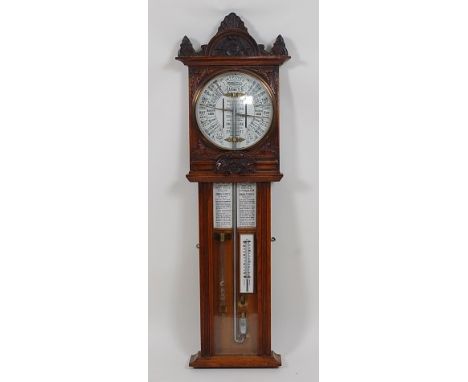 A late Victorian Admiral Fitzroy's oak 'Improved Torricelli Barometer', with white enamel circular main dial over twin annota