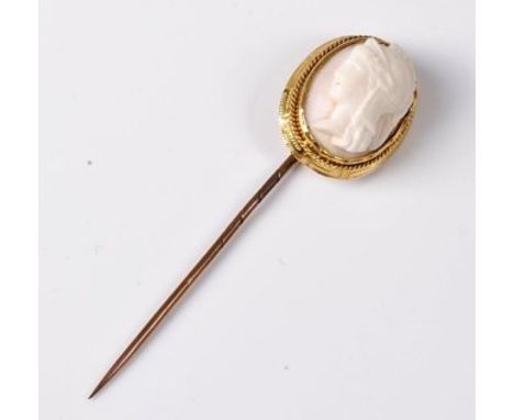 A cameo stick pin , the oval shell cameo of a classical maiden, in collet mount with rope twist and Greek key broder, open ba