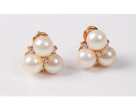 A pair of 18ct cultured pearl and diamond earrings, the three cultured pearls, set with four small round diamonds, 15mm long,