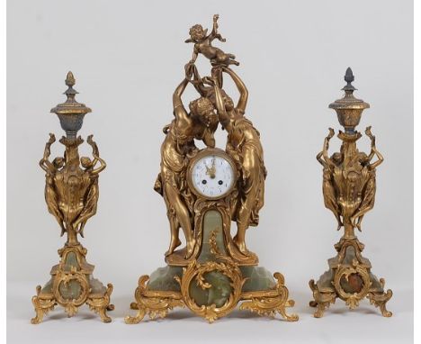 A circa 1900 French gilt metal and green onyx three-piece clock garniture, the clock having convex glass and enamelled dial f