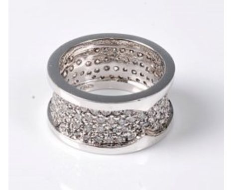 An 18ct wide full hoop eternity ring, the 1cm band pave set with small diamonds within an outer plain raised edge, total esti
