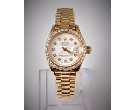 A lady's Rolex Oyster Perpetual Datejust wristwatch set with diamonds, the white dial with diamond hour markers, gold hands a