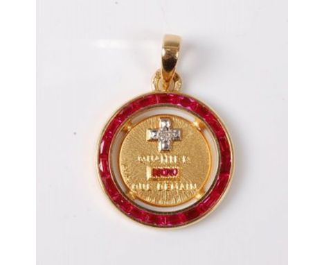 A ruby and diamond pendant, the round pendant set with an outer ring of calibre cut rubies and a central panel set with a cro