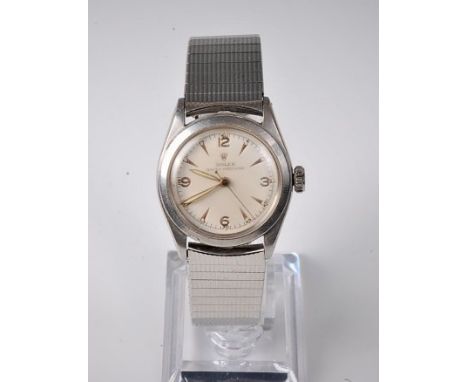 A gentleman's Rolex Oyster Precision manual wristwatch, the champagne dial with Arabic and baton numerals, seconds markers, s