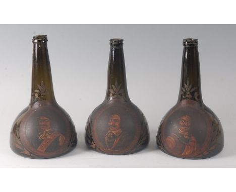 A set of three circa 1700 Dutch commemorative painted onion wine bottles, each with portrait reserves of Dutch admirals withi