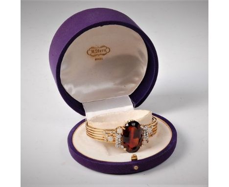 An 18ct and platinum mounted citrine, opal and diamond hinged bangle by H. Stern, Brasil, the large oval citrine approx. 28 x
