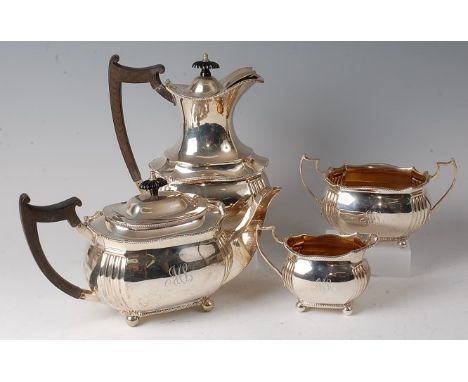 A George V silver four-piece tea and coffee service, comprising teapot, coffee pot, twin handled sugar and cream, each with g
