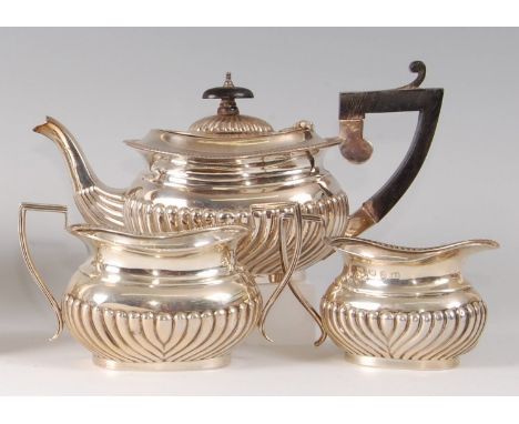 A silver bachelors three-piece tea set, in the early 19th century style, comprising teapot, twin handled sugar and cream, eac