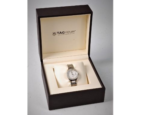 A lady's Tag Heuer Carrera automatic diamond set wristwatch, the mother of pearl dial with diamond hour markers, calendar fun