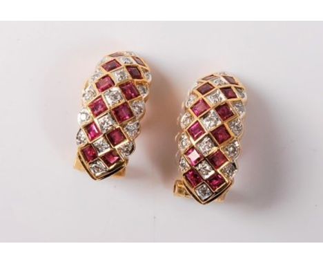 A pair of 18ct ruby and diamond earrings, the alternating rows of small round diamond set in white gold and two rows of squar