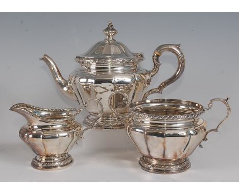 A late Victorian silver three-piece tea set, comprising teapot, twin handled sugar and cream, each of melon shape, the teapot