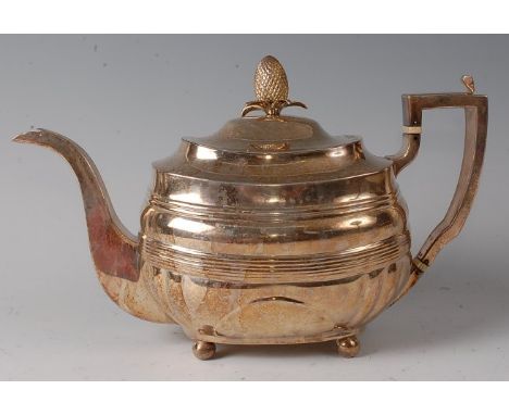 A late Georgian silver teapot, of oval bombe form, the domed cover with pineapple finial, 22.5oz, maker Duncan Urquhart &amp;
