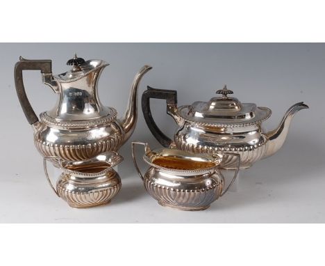 A late Victorian silver four-piece tea and coffee service, comprising teapot, coffee pot, twin handled sugar and cream, each 