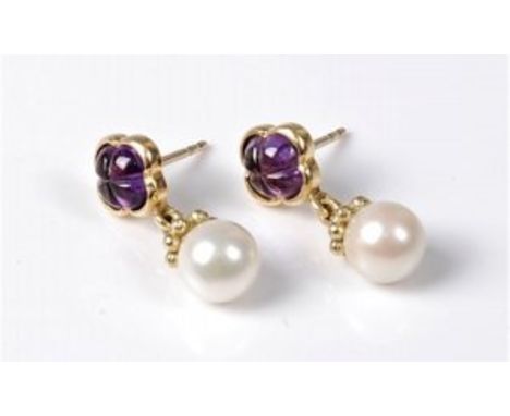 A pair of amethyst and cultured pearl earrings, the carved quatrefoil amethysts in collet mount and closed backs, with a sing