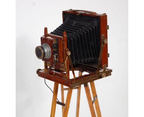 A late Victorian 'The Sandringham' brass mounted mahogany plate camera, having leather bellows, R&amp;G Beck Ltd lens No.1153