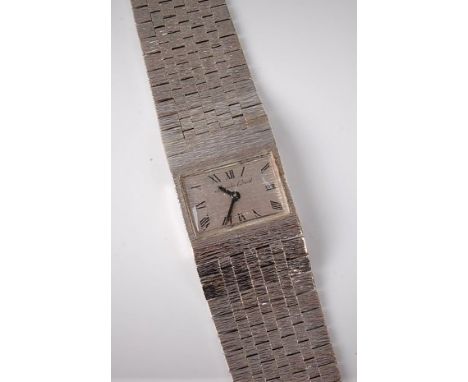 A lady's 9ct white gold Beuche Girod manual wristwatch, the rectangular dial with black Roman numerals and hands, 18mm wide, 