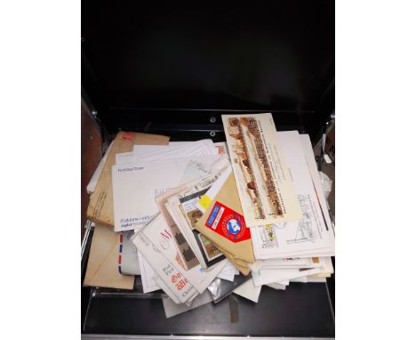 A briefcase containing first day covers 