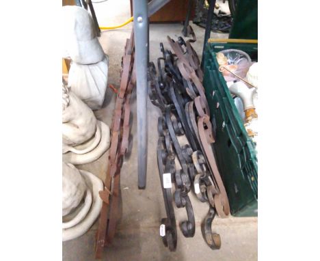 Ten wrought iron gate top scrolls. 