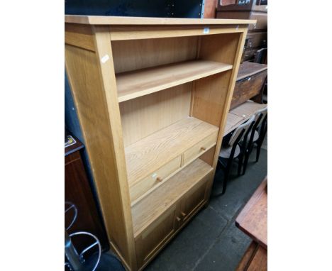 A modern light oak bookcase. 