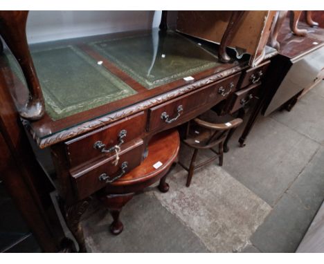 A mahogany desk, an oak coffee table and a child's commode chair. 