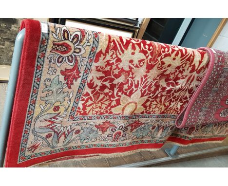 A Eastern style Padishah pattern wool carpet, red ground with foliate design, by Lano Carpets, 200cm x 285cm. 