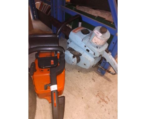 A Stihl chainsaw and a vintage chainsaw 