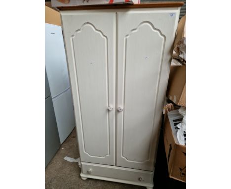 A painted pine wardrobe and contents including a cheval mirror, granddaughter clock. 