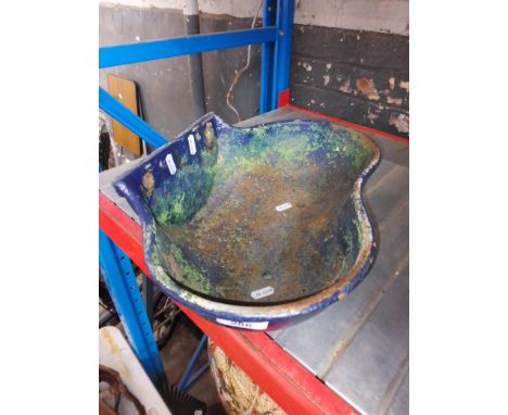 A small cast wall hanging planter 