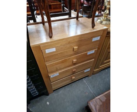 A modern light oak chest of drawers. 