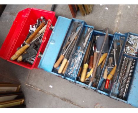 A plastic red tool box of assorted tools and a metal toolbox containing assorted tools 
