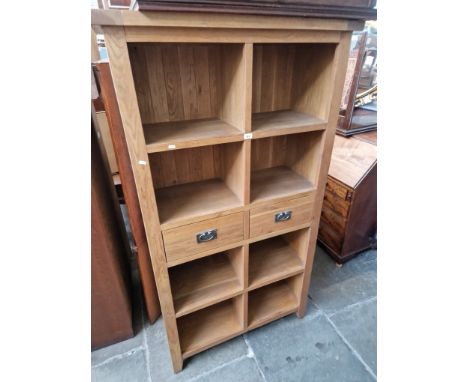 A modern light oak bookcase. 