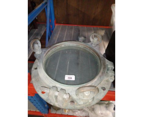 A brass port hole window.Condition:- General wear through age and use, light scratches to glass, functions ok, no sign of any