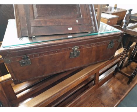 A large leather trunk/coffee table. 