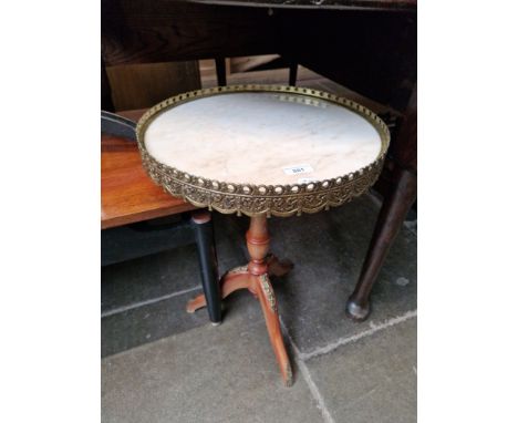 A French style marble top and gilt mounted tripod table. 