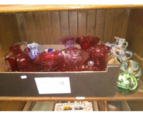 A mixed lot comprising cranberry glass, three glass dumps and four Masons jugs. 