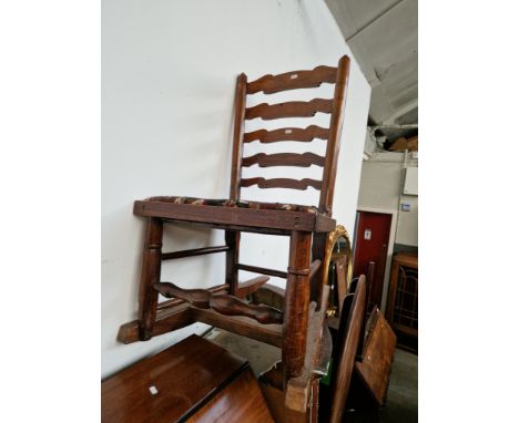 A ladder back rocking chair. 
