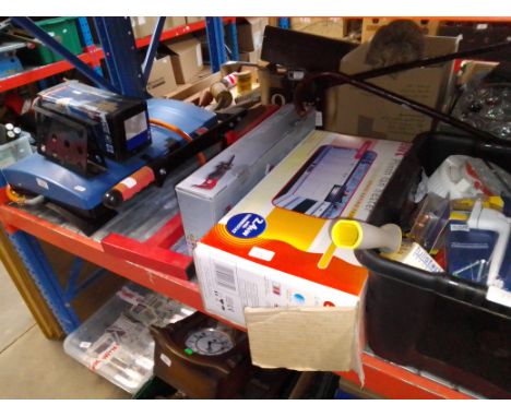 A box of tools, a camping gas cooker and lantern, and a laminate cutter 