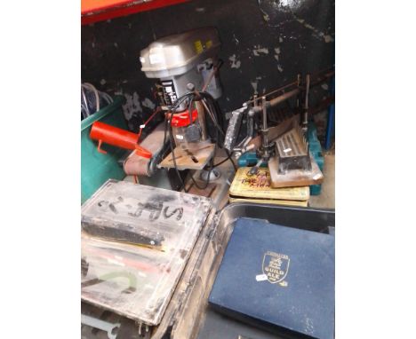 A mitre saw block, a box containing 8 Stanley chisels, a pillar drill, a bench belt sander, a christmas tree stand, Makita di