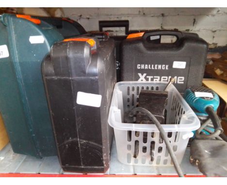 Assorted power tools and a bench vice. 
