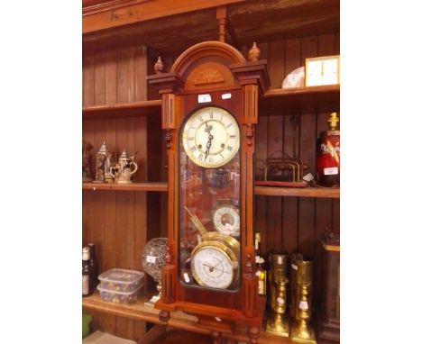 A PR 31 day wall clock with pendulum and key and 2 barometers, one brass case, one wood. 